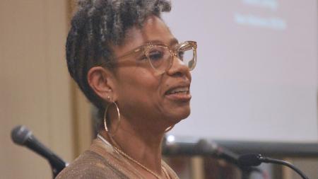 Teresa Jones speaking at the Race Relations 50th-anniversary dinner. 
