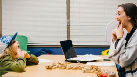 Jana Feuerstein, a first-year graduate student at Calvin University, works with a client at the on-campus clinic.