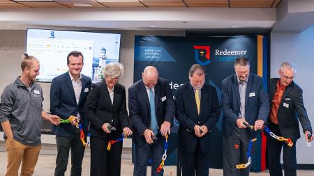 President David Zietsma, board chair Denis St. Amour, board vice chair Gina Taylor-Lunshof, academic vice president Peter Neumann, Innovation Centre director Harold DeVries, and student senate president Sebastian Caldwell participated in an official ribbon-cutting ceremony.