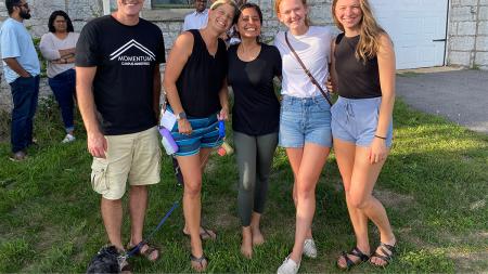 Gaur (center) is a leader with Momentum Campus Ministry.