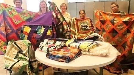 Some of the Creative Sisters display their work.