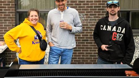 Pastor Terence Schilstra (center) helped to host a cookout for children at a local elementary school. 