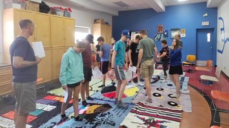 Young people from Guelph, Ont., participate in the Blanket Exercise at the Indigenous Family Centre in Winnipeg, Man.