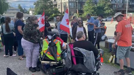 Community members gather for a barbecue dinner at Bridge Community Church in Langley, B.C.