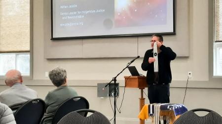 Adrian Jacobs talks to people at Ingersoll CRC about the Two Row Wampum belt.