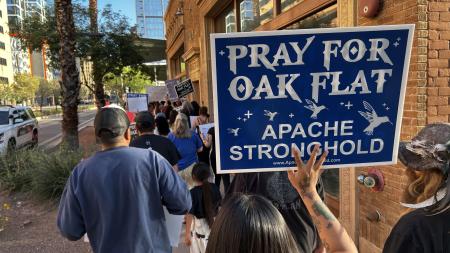 sign reading "pray for oak flat, apache stronghold"