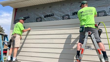 Volunteers repair a flood-damaged home in Iowa.
