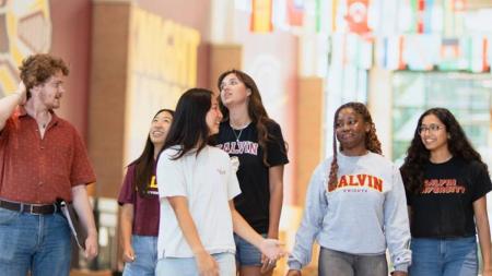 A group of students inside a Calvin University building.