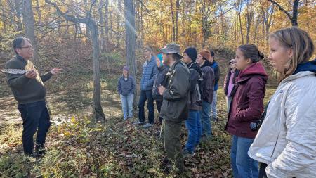 Adrian Jacobs (left) shares with Act 5 participants during an on-the-land learning experience.