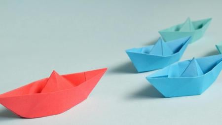 Blue and red paper boats