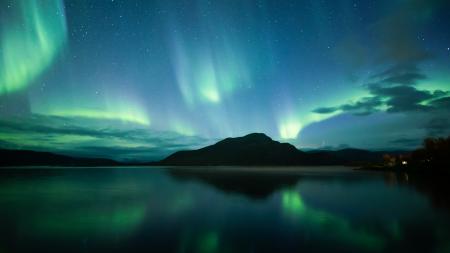 The northern lights over a lake
