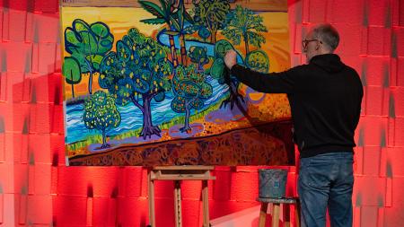 Joel Schoon-Tanis painted a desert scene representing the Psalms during the event.
