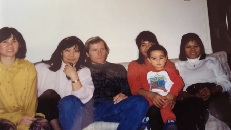 A family sitting on a couch