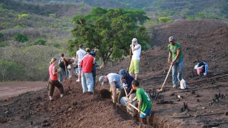 A group of people digging a trench in Honduras 