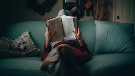 Overhead view of someone reading a book
