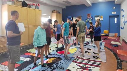 Young people from Guelph, Ont., participate in the Blanket Exercise at the Indigenous Family Centre in Winnipeg, Man.
