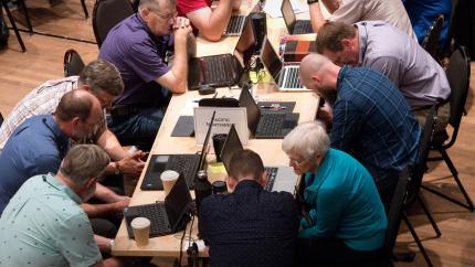 members of synod in prayer