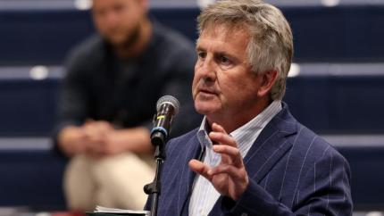 John Tamming speaks innto a microphone