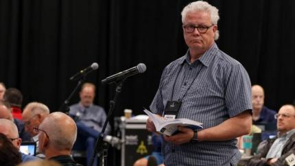 Martin Spoelstra speaks into a microphone