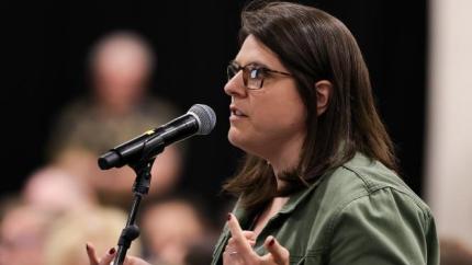 Brittany Clark speaks into a microphone