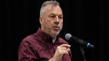 Kevin DeRaaf speaks into a microphone