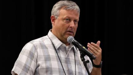 Scott Elgersma speaks into a microphone