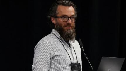 Brahdon Seaver talks into a microphone