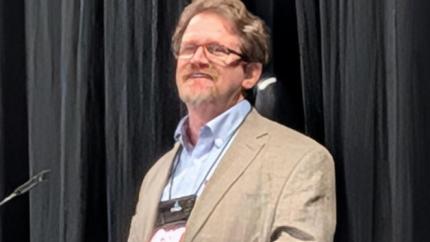 Zach King - bearded man behind microphone