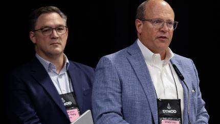 Noah Toly (Calvin Provost) and Perrin Rynders (incoming Calvin board chair) address Synod 2025