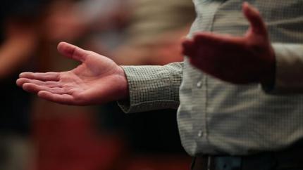 Synod 2026 hands in worship
