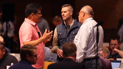men at Synod 2026 debating
