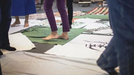 People participate in Blanket Exercise.