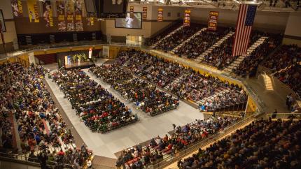 Tim Tebow speaks to a crowd in a packed VanNoord arena at Calvin University.