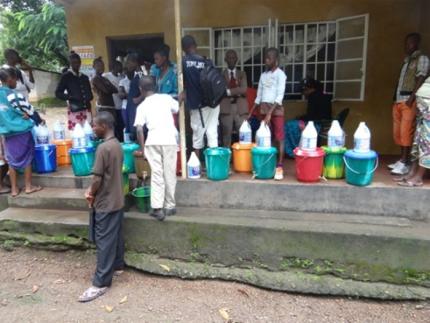 Buckets containing a chlorine mixture to be used to the kill the virus.