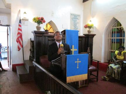 Samuel Reeves praying in his church