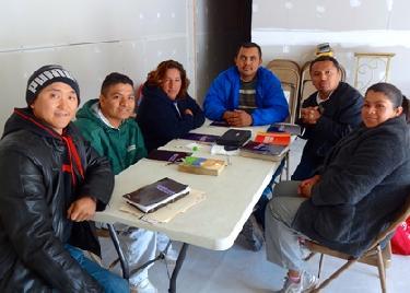 James (left) and Alex (in green) at a Bible study