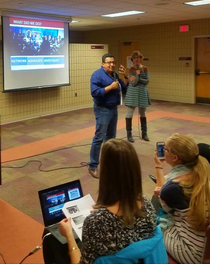 Carlos Hernandez speaks to students. Jo Ann Ver Beek is in the background.