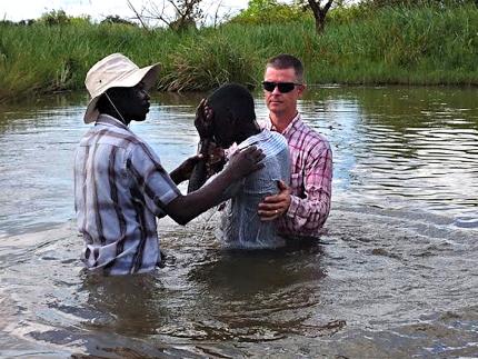 Missionary Josh Shaarda and a ministry partner baptize a new believer! For security concerns, Resonate cannot share photos from inside the prisons.