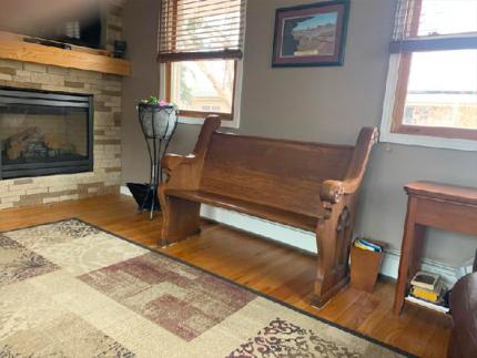 Richard spends his devotional time on this church pew, which came from his childhood church, as a way to remember his roots.