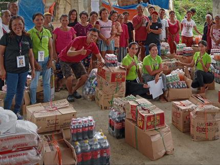 The beneficiaries of barangay Garcia posed for a group picture.