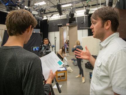  Calvin University professor works with a film student