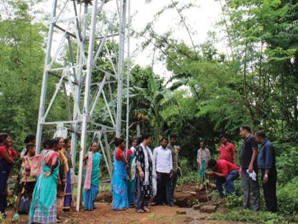 A newly installed water tank provides access to safe drinking water for a village in India.