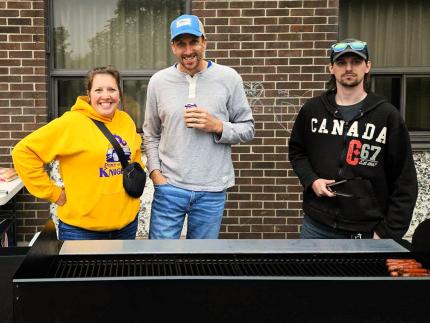 Pastor Terence Schilstra (center) helped to host a cookout for children at a local elementary school. 