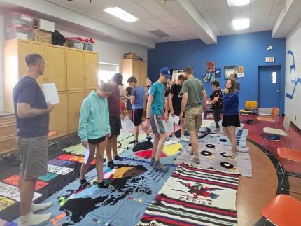 Young people from Guelph, Ont., participate in the Blanket Exercise at the Indigenous Family Centre in Winnipeg, Man.