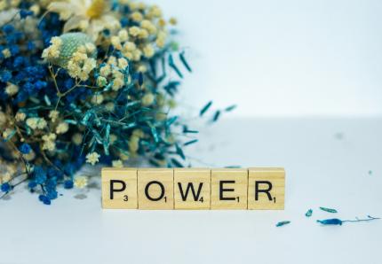 scrabble pieces spelling the word power