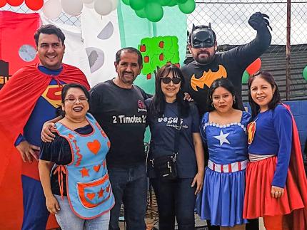 Maria, Rolando, and members of the church they lead held a community party for the grand reopening of the park. 