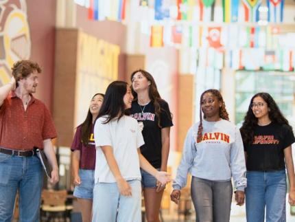 A group of students inside a Calvin University building.