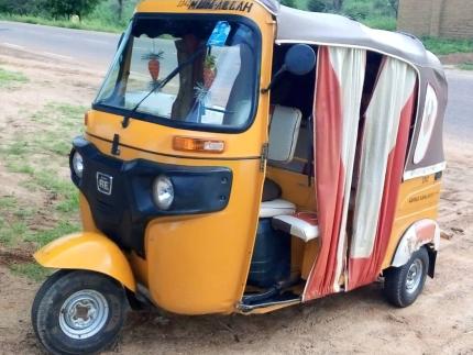 Paul uses a motorized tricycle to build relationships and share God’s Word.