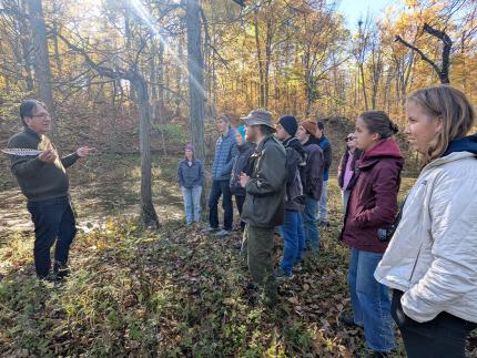 Adrian Jacobs (left) shares with Act 5 participants during an on-the-land learning experience.