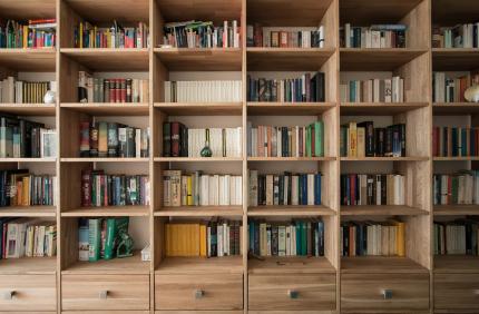 A floor to ceiling bookshelf full of books